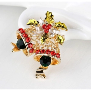 Christmas bell brooch with red rhinestones and green holly leaves on gold metal