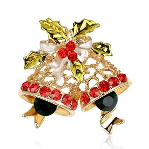 Sparkling Christmas bell brooch with gold hollow design and festive enamel holly leaves