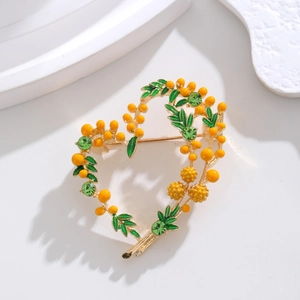 Exquisite gold heart brooch with mimosa fruit enamel leaves and green rhinestones