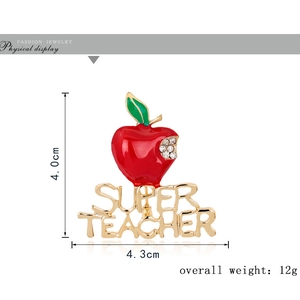 Red apple Christmas brooch with Super Teacher text and rhinestones on white background