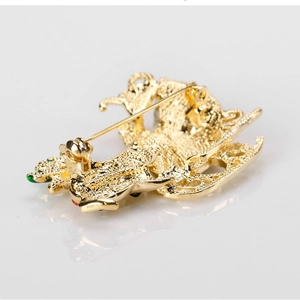 Detailed back view of a golden Christmas sleigh brooch with secure rotating clasp and pin