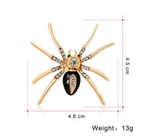 Gedetailleerd beeld van een gouden spinnenbroche met strassteentjes, 4.8cm x 4.5cm