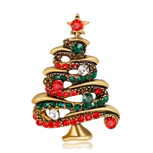 Detailed view of Christmas tree brooch with red, green and white crystal rhinestones