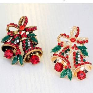 Christmas alloy double bell brooch with red and green rhinestones on textured background