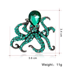 Green crystal octopus brooch with emerald rhinestones and black metal base for clothing