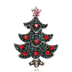 Elegant Christmas tree brooch with sparkling green and red crystals on silver metal base