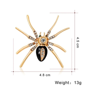 Groot vintage gouden spinnenbroche met witte strasstenen en details van zwart email