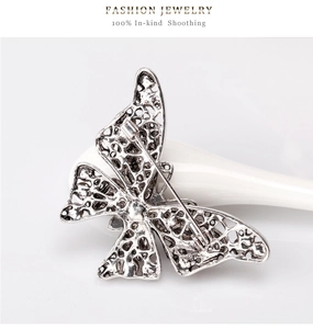 Detail view of the vintage silver butterfly brooch showing hollow back and pin clasp
