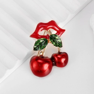 Creative cherry and red lip brooch in red and green enamel with gold plating
