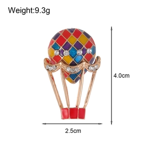 Colorful hot air balloon brooch with enamel plating and crystals on a metal frame