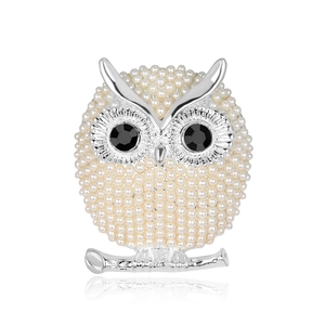 Elegant owl brooch with white faux pearls and black gemstone eyes on silver metal base