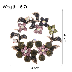 Vintage olive branch wreath brooch with colorful rhinestones in an alloy base