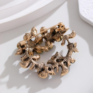 Vintage olive branch wreath brooch with rhinestones in antique gold finish