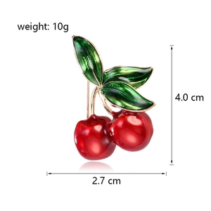 Fashionable cherry brooch with red enamel and gold finish, dimensions 4.0cm by 2.7cm