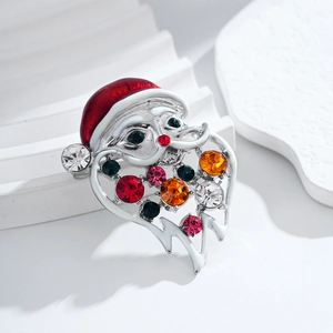 Exquisite Santa Claus brooch with colorful rhinestones and red enamel on white background