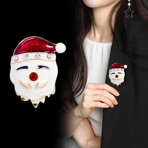 Christmas Santa Claus brooch with red rhinestones and enamel on a black suit blazer