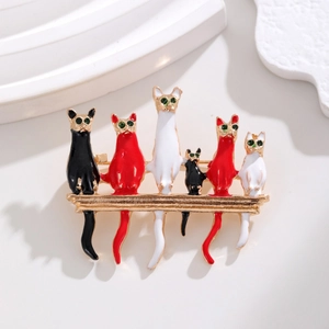 Cartoon enamel cat brooch featuring six colorful cats on a gold metal bar accessory