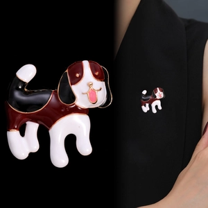 Detail of beagle dog enamel brooch pin showing alloy craftsmanship on dark fabric jacket