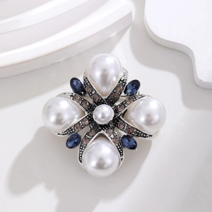 Vintage Baroque cross brooch with white teardrop pearls and blue crystal embellishments