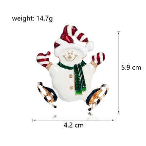 Enamel Christmas snowman brooch with red hat and green scarf on white background