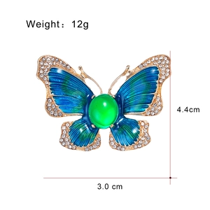 Spilla a farfalla dorata con smalto blu sfumato e strass scintillanti per vestiti