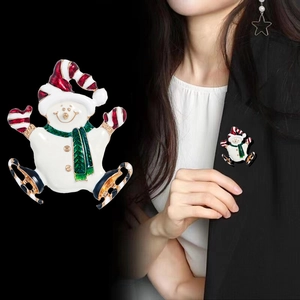 Christmas snowman enamel brooch with ice skates on black suit jacket lapel