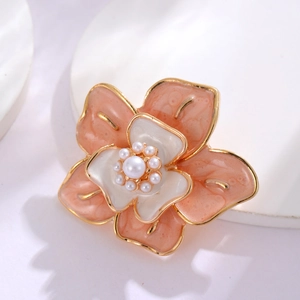 Vintage camellia brooch with pink enamel petals and pearl center for jackets