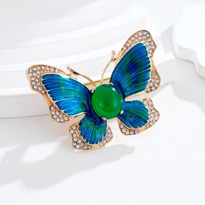 Elegante spilla a farfalla in smalto sfumato verde smeraldo e blu con strass