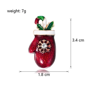 Christmas glove brooch in red enamel with snowflake and candy cane holiday accents