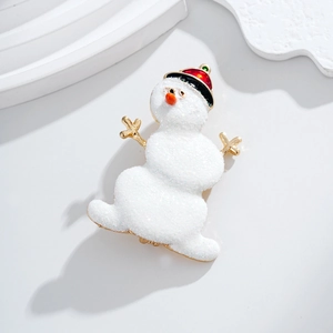 Christmas snowman brooch in white matte texture with red hat on a minimalist background