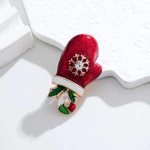 Christmas red enamel mitten brooch with gold snowflake and candy cane charm detail