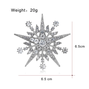 Sparkling silver eight-pointed star brooch with inlaid crystals, 6.5cm size