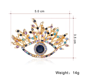 Tableau de taille détaillée d'une broche œil vintage avec strass colorés en alliage d'or