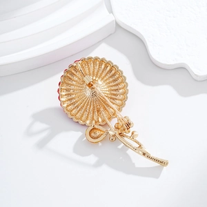 Elegant gold-plated red enamel flower brooch featuring a vintage-style petal texture