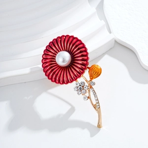 Elegant red enamel flower brooch with pearl center and crystals on a gold alloy stem