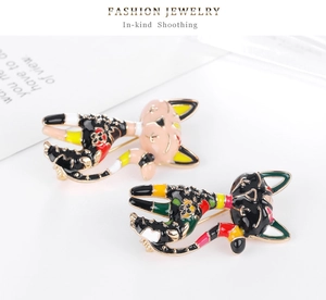 Close-up of cute cartoon cat brooches with colorful enamel finish and gold alloy plating