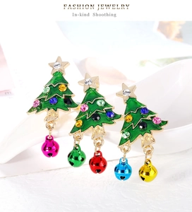 Detail view of enamel Christmas tree brooch with colorful bells and rhinestone inlay