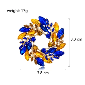 Broche couronne de blé dorée élégante avec cristaux bleus et ambre, diamètre 3,8 cm