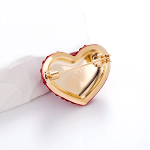 Romantic gold-plated heart brooch with red crystals and secure pin clasp back view