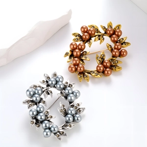 Elegant floral pearl wreath brooches in vintage gold and silver with rhinestone details
