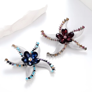 Eleganti spille a stella marina con cristalli colorati su base argento lucido