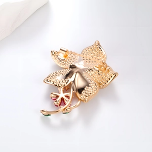 Exquisite gold floral brooch with pearl inlay and secure safety pin back for suit coats