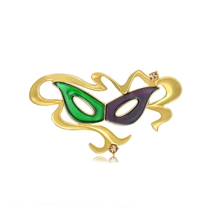 Spilla maschera creativa in lega con smalto verde e viola e strass color ambra chiari