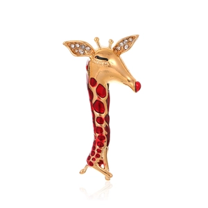 Elegant vintage giraffe brooch in gold finish with red enamel spots and crystals