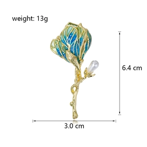 Elegant floral brooch with blue enamel petals and a pearl, sized 6.4cm x 3.0cm