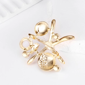 Golden starfish and shell enamel brooch with pearls shown from a back-view detail angle