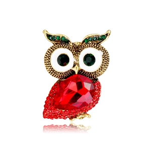 Vintage owl brooch with red teardrop crystal and green rhinestone eyes on gold base