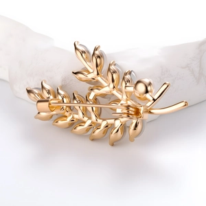 Elegant wheat stalk brooch with crystal and gold finish shown from a back perspective
