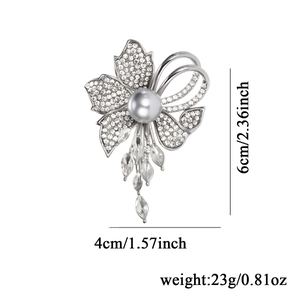 Elegant flower brooch with silver plating, white pearl and sparkling crystal tassels