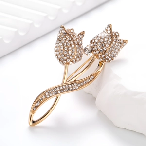 Élégante broche tulipe en alliage doré avec strass blancs étincelants pour femmes